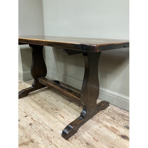 492 - An oak refectory dining table on shaped standards and platform stretcher, 150cm x 74cm