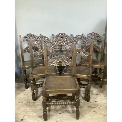 496 - A set of six yolk back oak dining chairs of 17th century design, turned and square framing with bobb... 