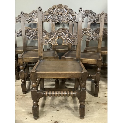 496 - A set of six yolk back oak dining chairs of 17th century design, turned and square framing with bobb... 