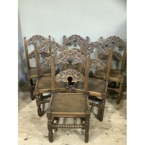 496 - A set of six yolk back oak dining chairs of 17th century design, turned and square framing with bobb... 