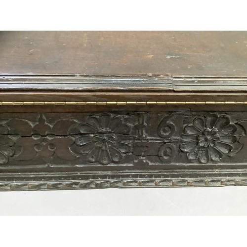 507 - An oak bible box with gouge cut detailing and carved floret front, carved 1670, later converted to a... 