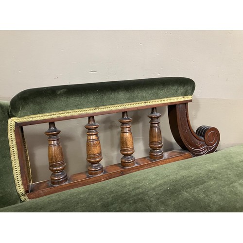 510 - A Victorian walnut chaise longue upholstered in green velvet and on turned legs