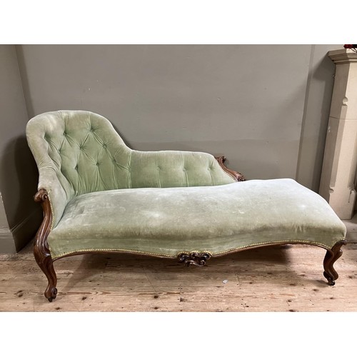 511 - A Victorian walnut chaise long upholstered in a pale green velvet (back at fault)