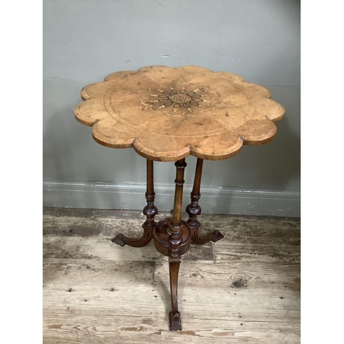 514 - A Victorian figured walnut occasional table, circular with scalloped rim, inlaid to the centre with ... 