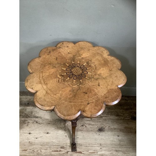 514 - A Victorian figured walnut occasional table, circular with scalloped rim, inlaid to the centre with ... 