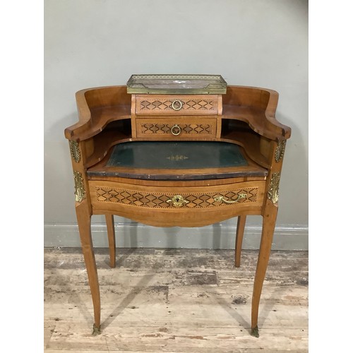 497 - A lady's walnut, satinwood and parquetry writing desk with gilt mounts in the French manner, having ... 