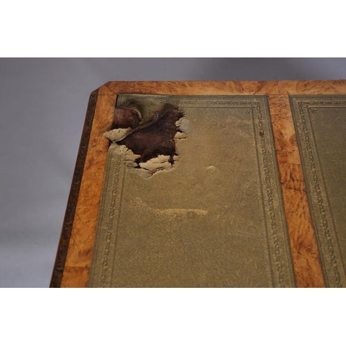 499 - An 18th century style figured walnut desk, inverted breakfront, having three incised leather panels,... 