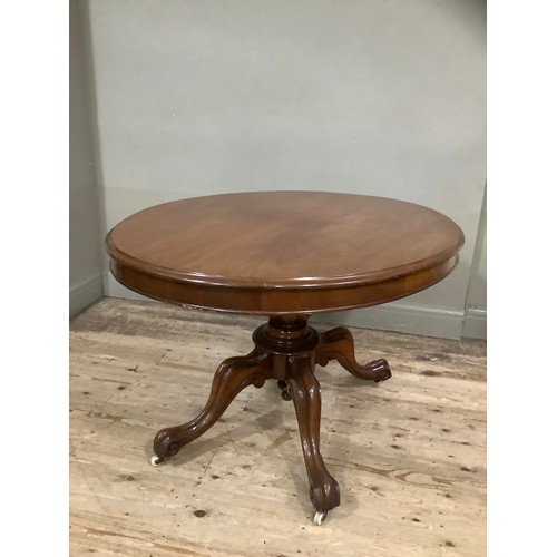 504 - A mahogany Victorian oval  Looe table on carved baluster column on four moulded cabriole legs with c... 