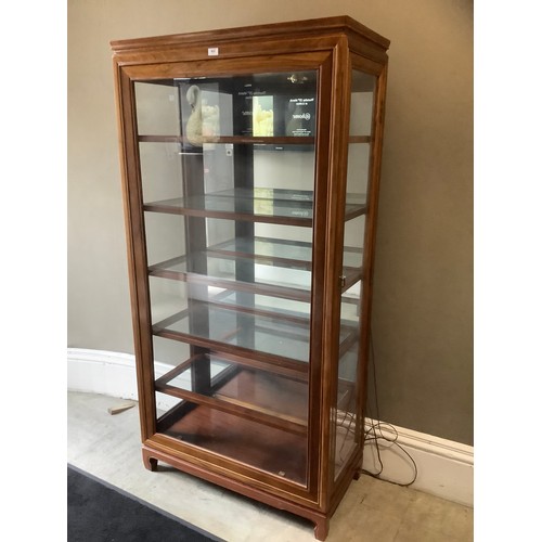 453 - A Chinese teak and glazed display cabinet of five shelves with side opening doors, 91cm wide x 183cm... 