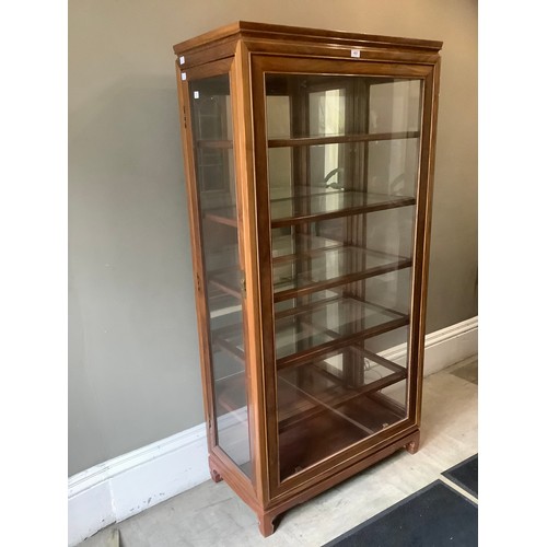 453 - A Chinese teak and glazed display cabinet of five shelves with side opening doors, 91cm wide x 183cm... 