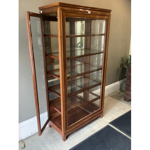 453 - A Chinese teak and glazed display cabinet of five shelves with side opening doors, 91cm wide x 183cm... 