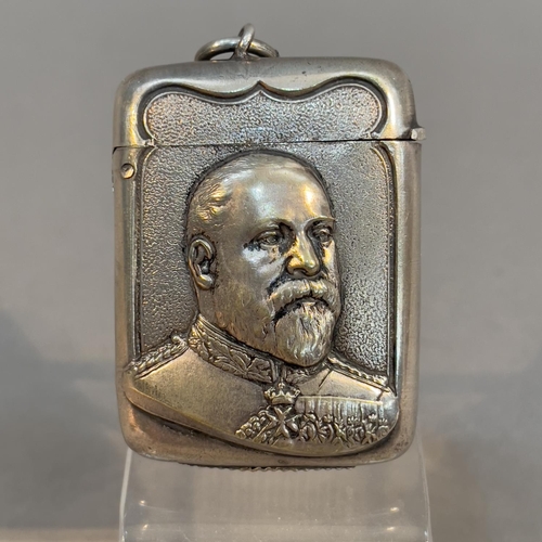 63 - An Edward VII commemorative base metal vesta embossed with a head and shoulders portrait of Edward, ... 