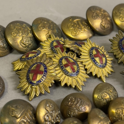 28 - A collection of approximately 70 early to mid 20th century military buttons, shoulder pips and milit... 