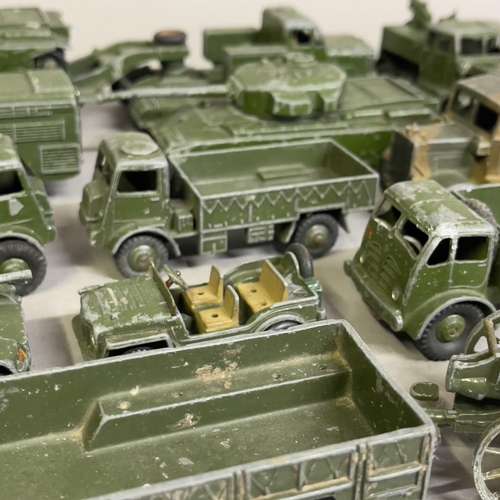 97 - A collection of 15 play worn Dinky Toys and Supertoys military vehicles including two 651 Centurion ... 