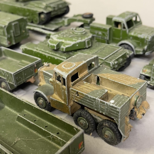 97 - A collection of 15 play worn Dinky Toys and Supertoys military vehicles including two 651 Centurion ... 