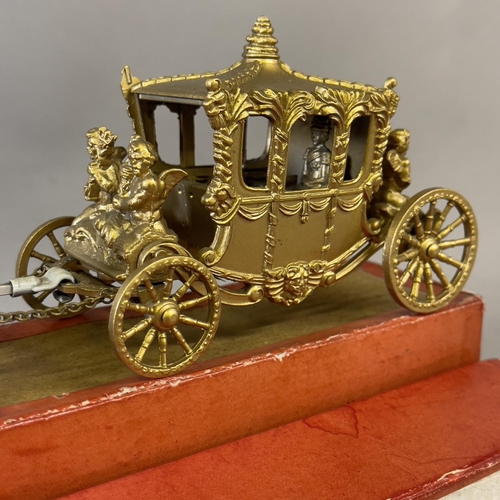 98 - A Lesney Products Coronation Coach, boxed, with Queen Elizabeth figure and all chains to carriage an... 