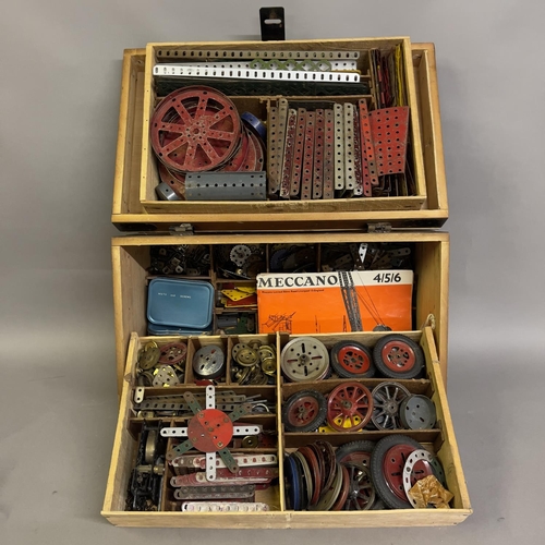 99 - A quantity of Meccano in a three-tier wooden case, including a large number of brass gears, pinions ... 