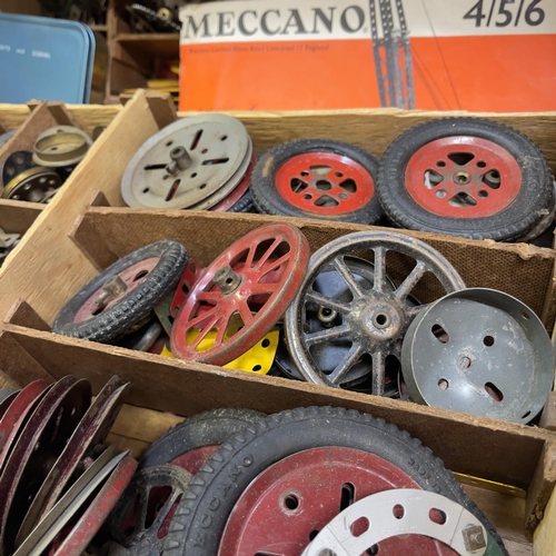 99 - A quantity of Meccano in a three-tier wooden case, including a large number of brass gears, pinions ... 