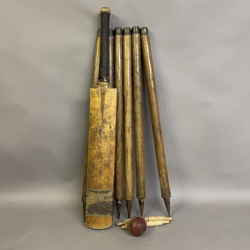 94 - A Fred Milner ‘Don Bradman’ cricket bat, along with a set of six stumps, four bails and a ball