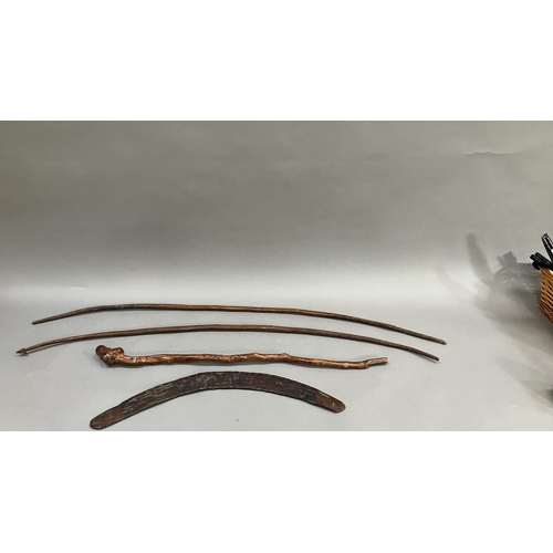 33 - A 19th century Aboriginal boomerang and two bows, together with a Chinese root wood stick