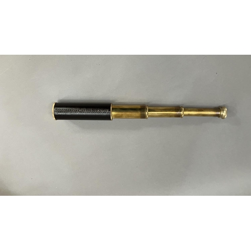 29B - A three draw brass and leather wrapped telescope