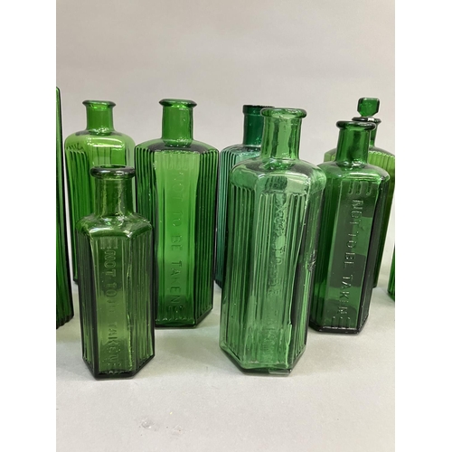 86 - A collection of eleven green glass poison bottles (two with stoppers), 12.5cm to 22.5cm high