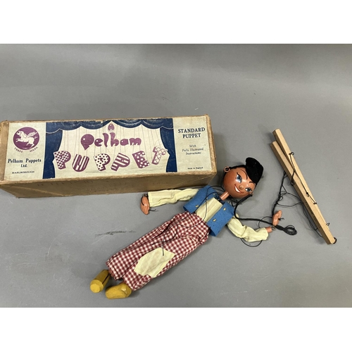 75 - A Pelham Puppet 'Dutch Boy', in original box together four others, unboxed, including Mexican Gunsli... 