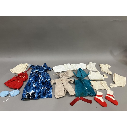 76 - A quantity of doll's clothes, babies bonnets and bootees