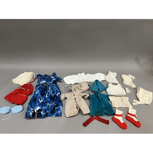 76 - A quantity of doll's clothes, babies bonnets and bootees