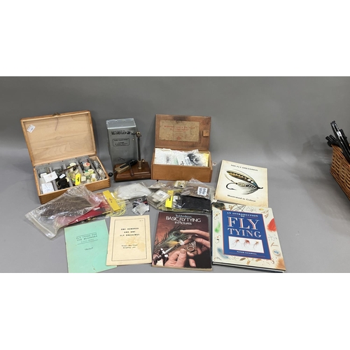 257 - Fishing: two boxes of fly tying equipment, a fly tying vice, five fly tying books