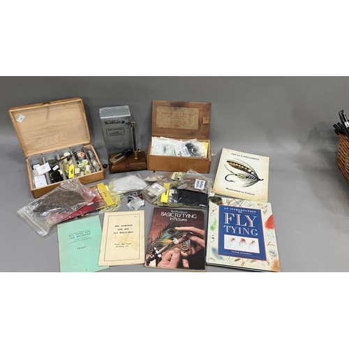 257 - Fishing: two boxes of fly tying equipment, a fly tying vice, five fly tying books