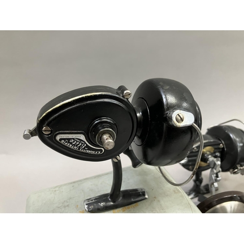 255 - A Penn No 79 bakelite fishing reel and a Penn No 85 bakelite fishing reel together with an Ocean Cit... 