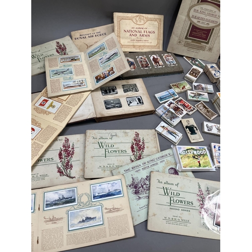 166 - A large quantity of cigarette and trade cards in albums and loose (1000+)