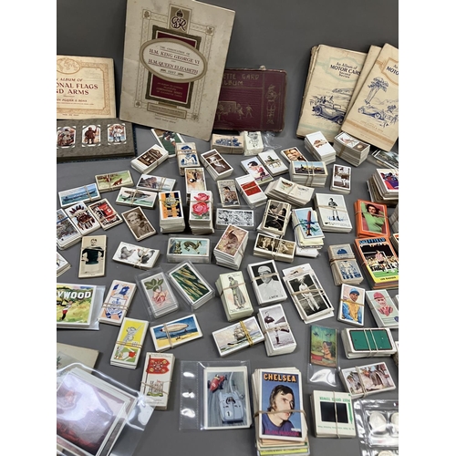 166 - A large quantity of cigarette and trade cards in albums and loose (1000+)