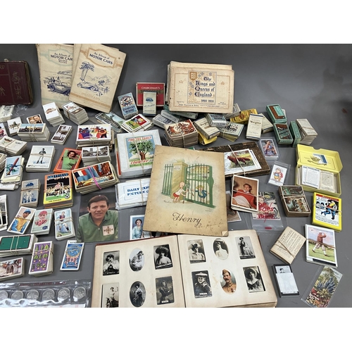 166 - A large quantity of cigarette and trade cards in albums and loose (1000+)