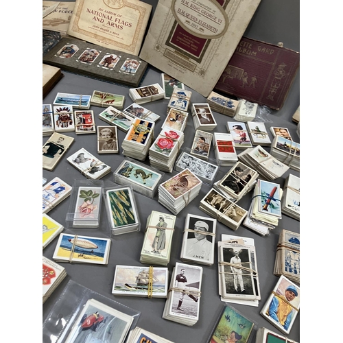 166 - A large quantity of cigarette and trade cards in albums and loose (1000+)