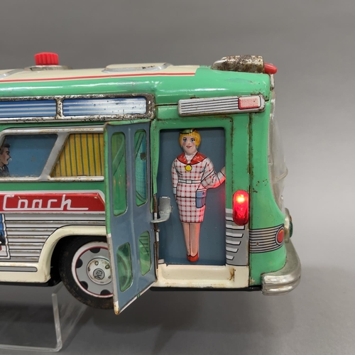 107 - A 1950s Yonezawa ‘Avenue Coach’ tin plate model measuring 42cm long, being battery operated and in w... 