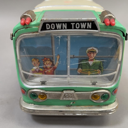 107 - A 1950s Yonezawa ‘Avenue Coach’ tin plate model measuring 42cm long, being battery operated and in w... 