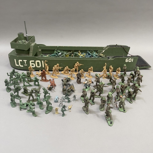 109 - A good number of plastic and metal model soldiers from Herald, Charbens and others, along with a LCT... 