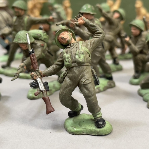 109 - A good number of plastic and metal model soldiers from Herald, Charbens and others, along with a LCT... 