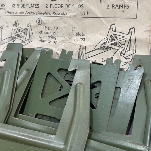 110 - A tin plate Becklin Bridge model, with instructions, including seven cross members, 12 side plates, ... 