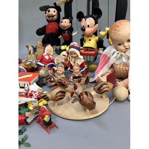 117 - A collection of Walt Disney toys, including a Selco Mickey Mouse, a Burbank Toys pull string Mickey ... 