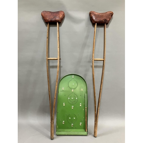 68 - A pair of early 20th century wood and leather crutches by the Wantage Adjustable Crutch Company, alo... 