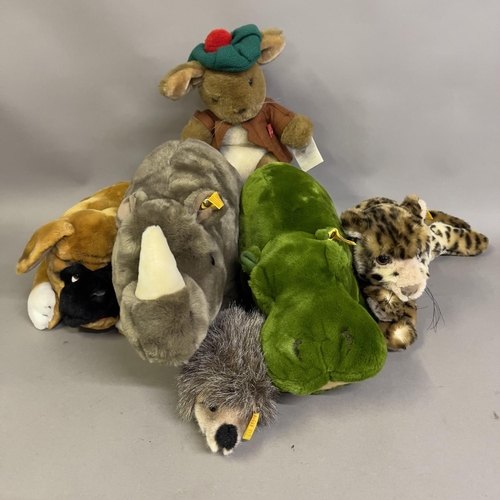 121B - A collection of six Steiff animals including cheetah, Boxer dog, green hippo, Rhinoceros, small hedg... 