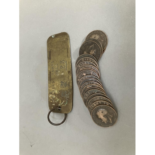 64 - An Edwardian Imperial Hotel brass room key together with twenty 1919 H pennies