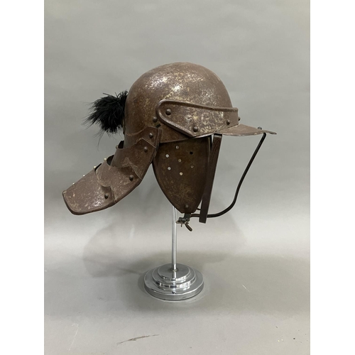 29 - A reproduction steel English Civil War period style lobster-tailed pot helmet with three bar face gu... 