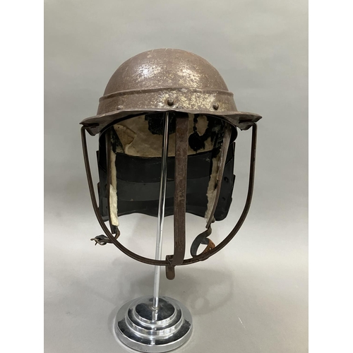 29 - A reproduction steel English Civil War period style lobster-tailed pot helmet with three bar face gu... 