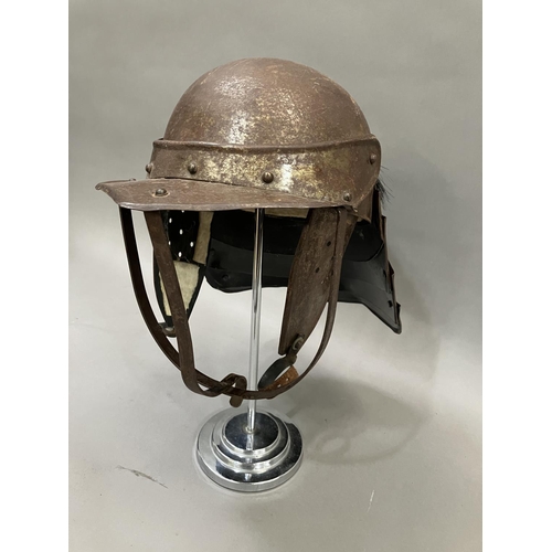 29 - A reproduction steel English Civil War period style lobster-tailed pot helmet with three bar face gu... 