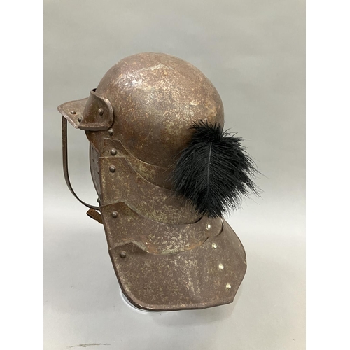 29 - A reproduction steel English Civil War period style lobster-tailed pot helmet with three bar face gu... 