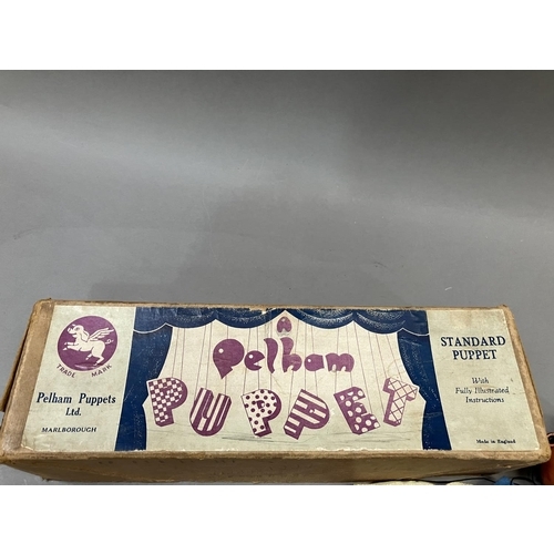 75 - A Pelham Puppet 'Dutch Boy', in original box together four others, unboxed, including Mexican Gunsli... 